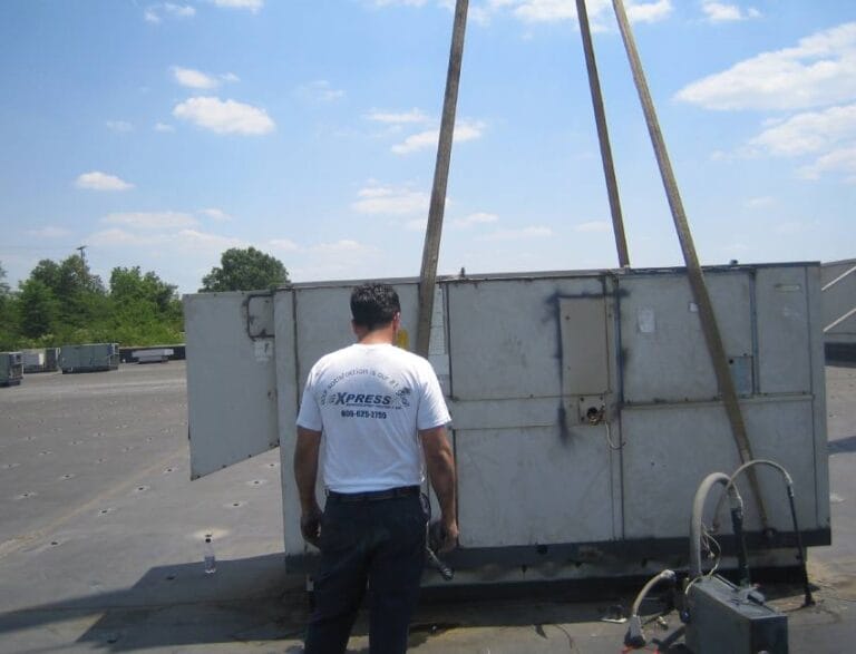 Rooftop unit lifted by crane
